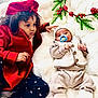 Amal is registered to the contest to win money with this photo: child, baby, sibling, red_coat, hat, pacifier, knitwear, blanket, holiday, festive, greenery, indoor, cute, warm_clothing, curly_hair, infant, toddler, portrait, family, cozy