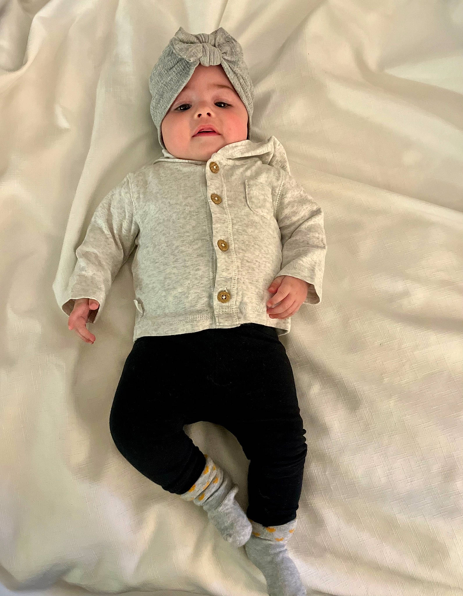 Akira joined the competition — help win amazing prizes! baby, baby_toddler_clothing, child, collar, comfort, costume, face, fashion_design, fur, hat, headwear, hood, human_body, jacket, knee, pattern, person, sitting, sleeve, toddler
