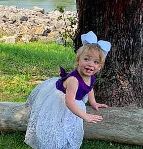 Fallon is registered to the contest to win money with this photo: baby, baby_toddler_clothing, child, fun, grass, grassland, happy, hat, joy, landscape, lawn, leisure, mammal, people_in_nature, person, plant, recreation, sitting, smile, t_shirt