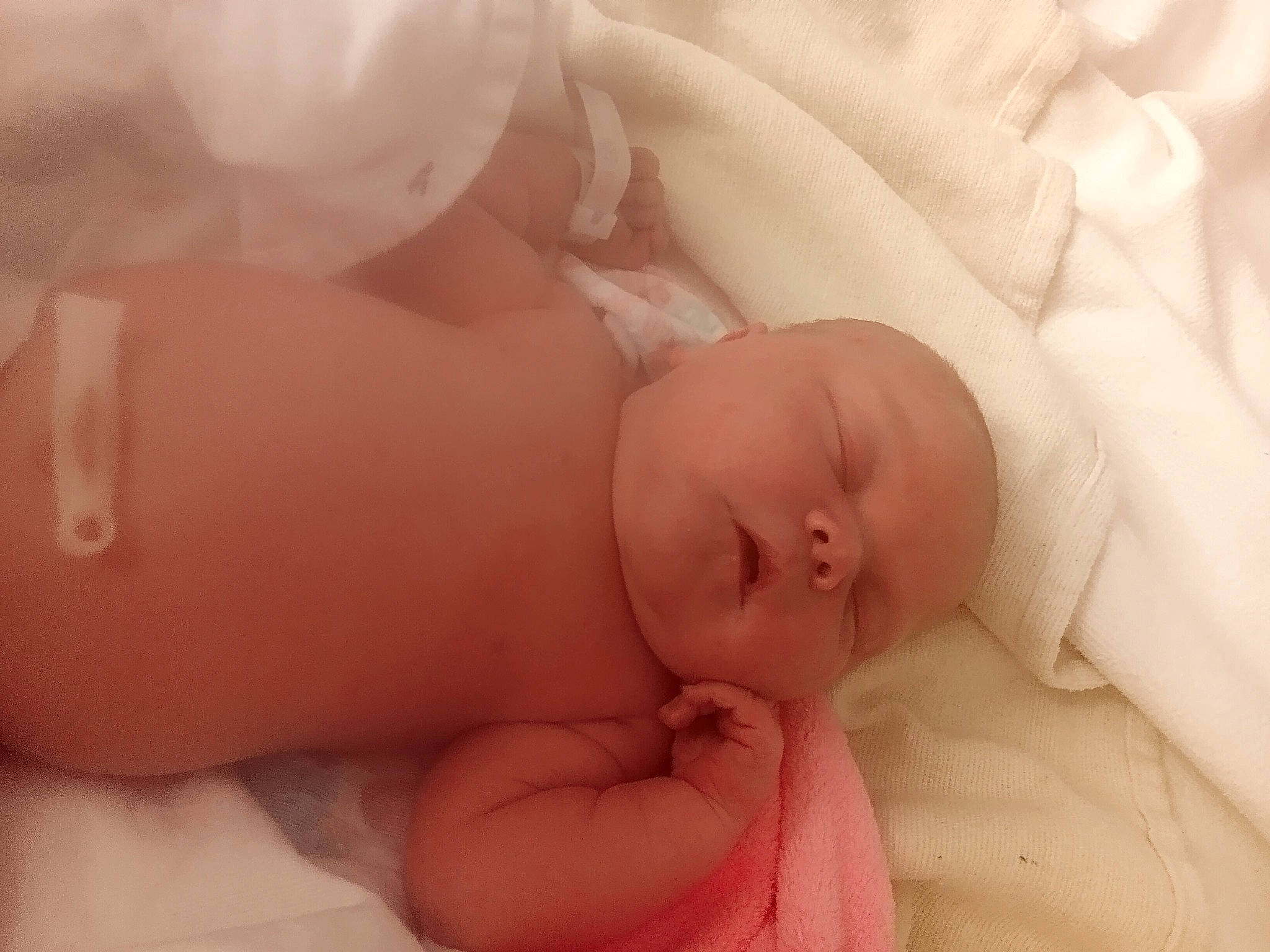 Briella is registered to the contest to win money with this photo: abdomen, arm, baby, cheek, comfort, ear, eye, finger, gesture, hand, happy, human_body, lip, mouth, nail, nose, person, pink, skin, stomach