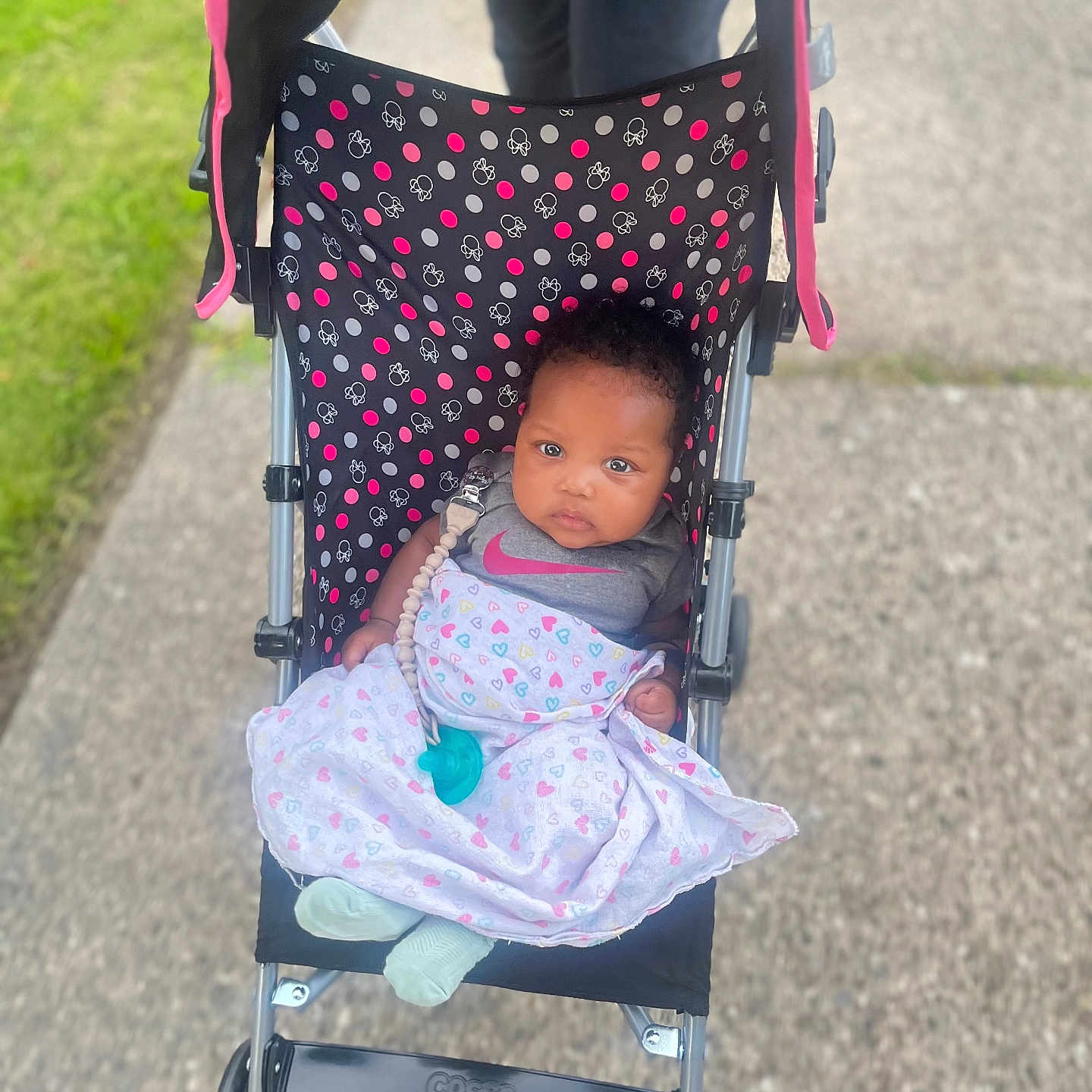 Kaia joined the competition — help win amazing prizes! adult, architecture, baby, building, city, face, female, head, machine, outdoors, person, photography, portrait, road, shelter, street, stroller, urban, wheel, woman