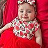 Mia is registered to the contest to win money with this photo: apparel, baby, baby_girl, child, colorful, cushion, cute, face, happy, headband, indoor, infant, lying_down, minnie_mouse, portrait, red_clothing, smile, soft_toys, strawberry_pattern, tutu