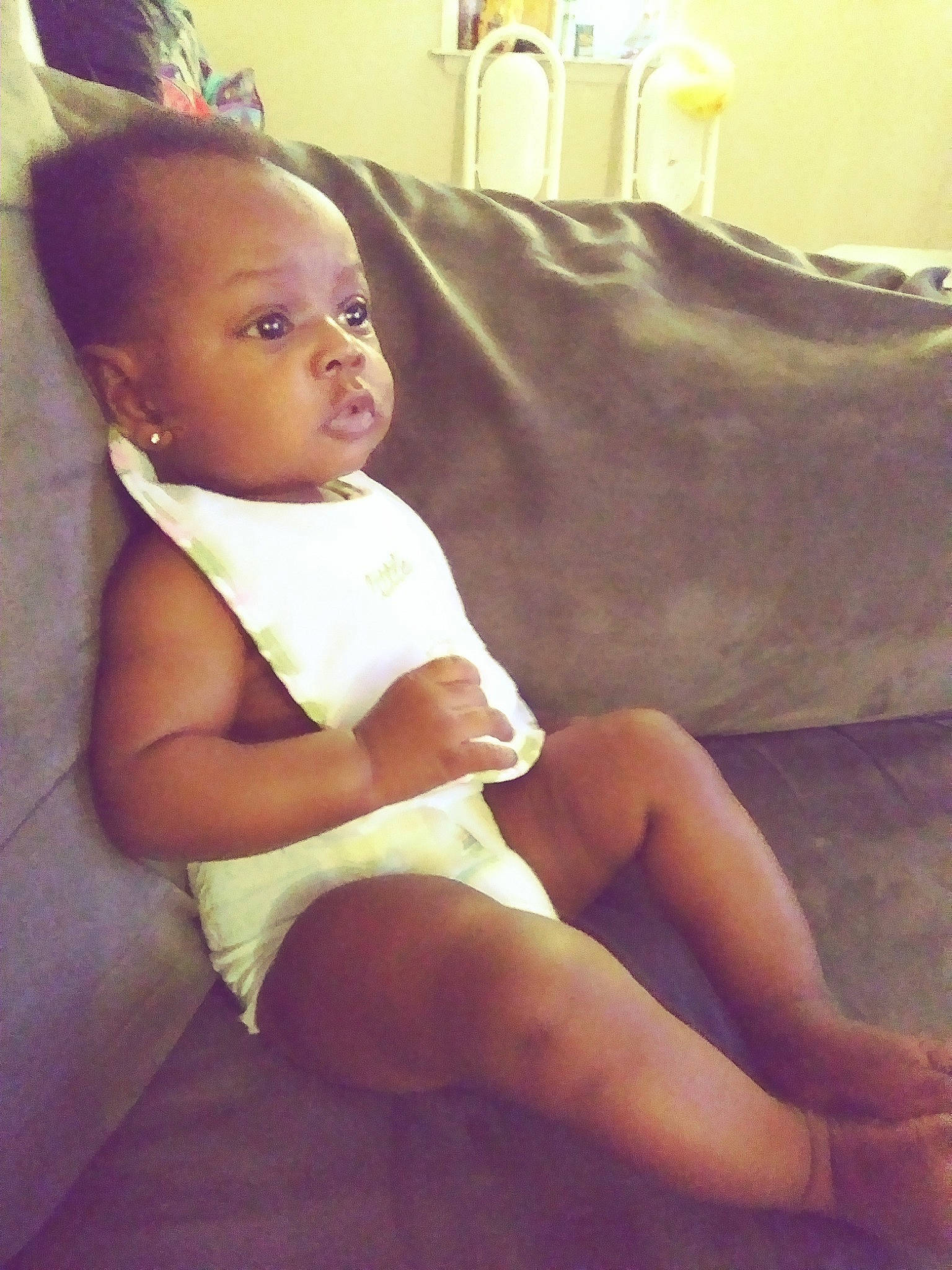 Eli'Yah is registered to the contest to win money with this photo: arm, child, ear, human_leg, leg, person, sitting, thigh, toddler