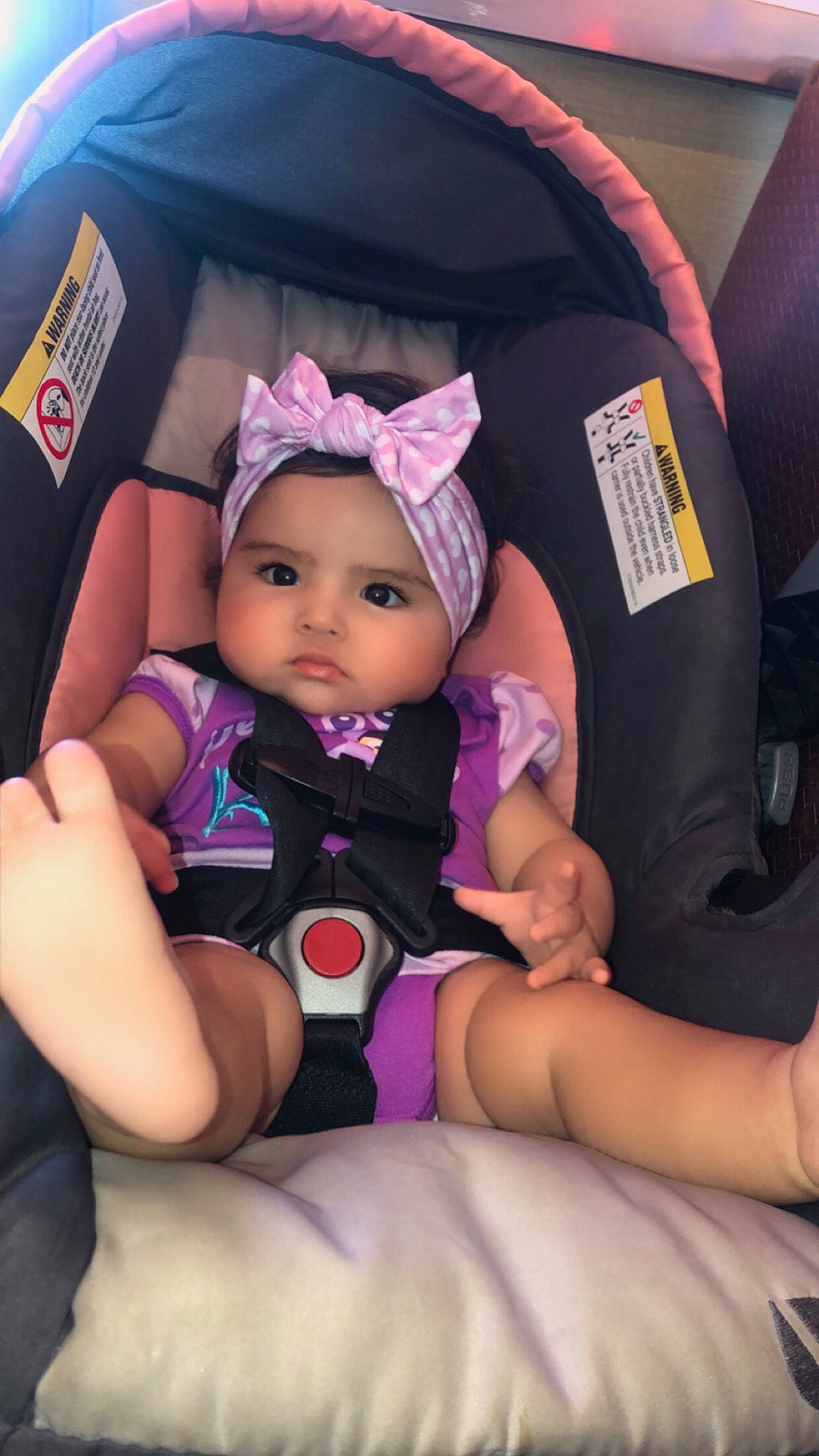 Nalianna is registered to the contest to win money with this photo: baby, baby_carriage, baby_in_car_seat, baby_toddler_clothing, cap, car_seat, comfort, finger, fun, headwear, lap, magenta, nail, people, person, purple, seat_belt, skin, thigh, thumb