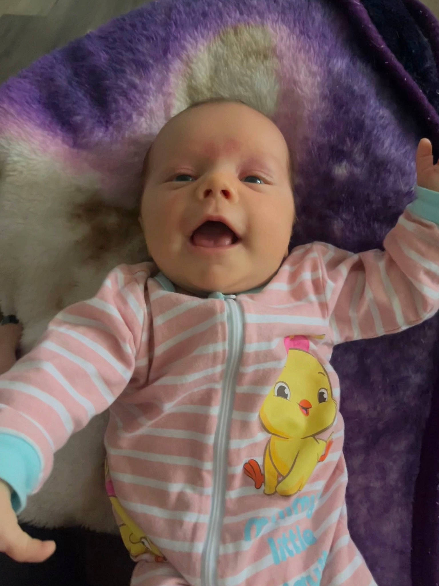 Arya is registered to the contest to win money with this photo: baby, baby_products, baby_toddler_clothing, cheek, child, chin, comfort, face, gesture, happy, head, lip, nose, person, pink, skin, sleeve, smile, textile, toddler