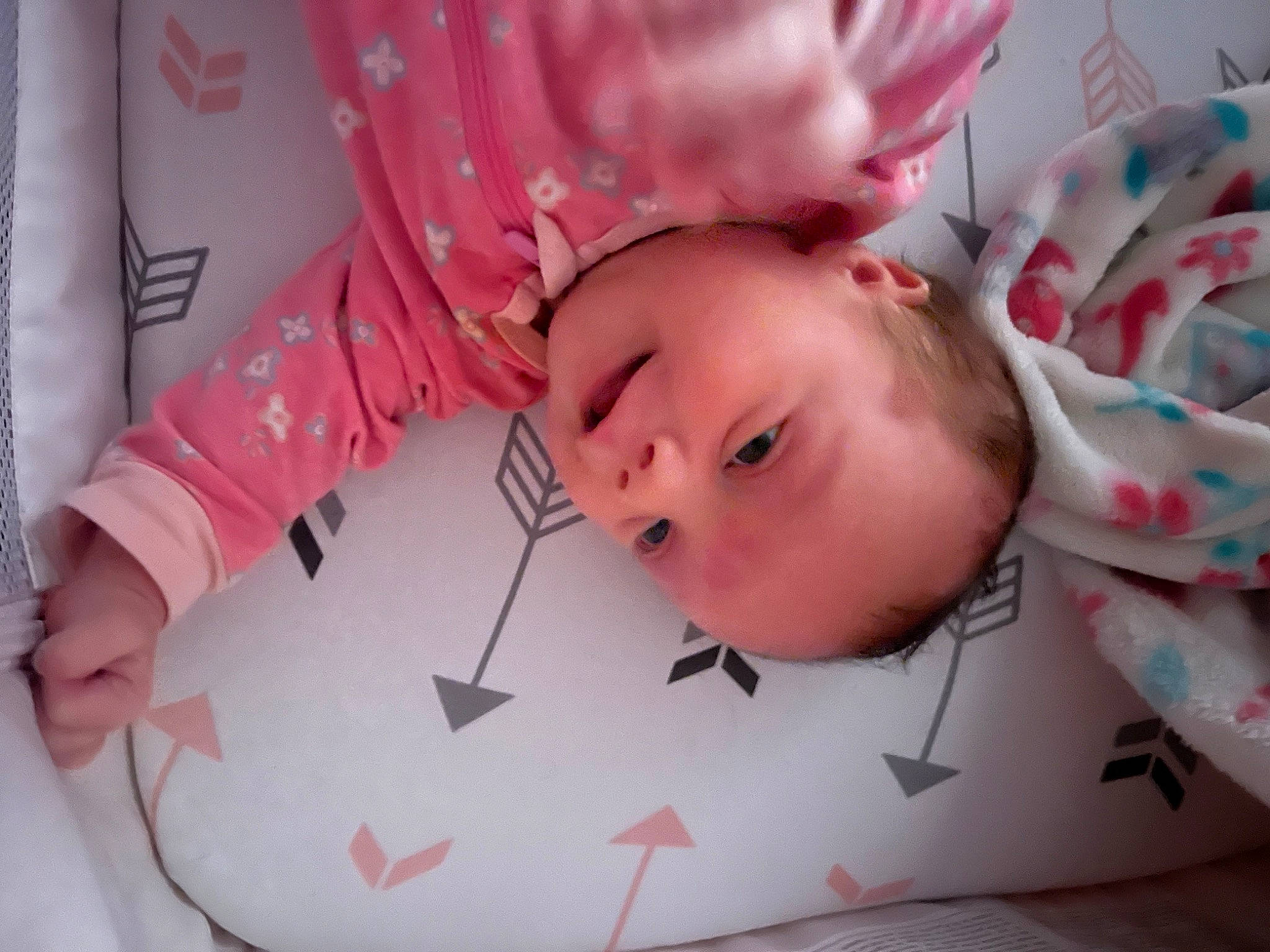 Arya is registered to the contest to win money with this photo: baby, baby_toddler_clothing, cheek, child, comfort, eyebrow, eyelash, fashion_accessory, happy, linens, lip, magenta, pattern, person, pink, portrait_photography, room, skin, sleeve, textile