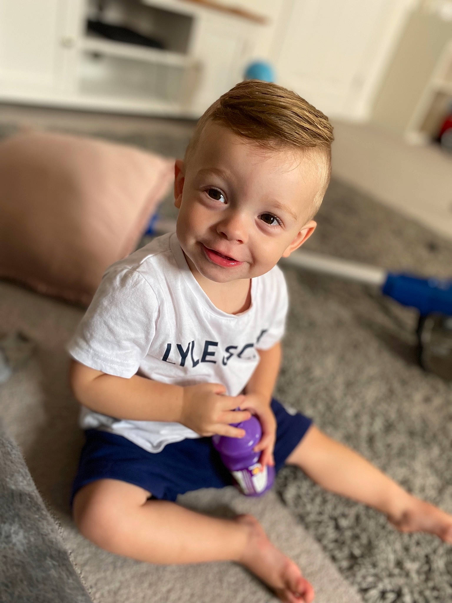 Vinnie joined the competition — help win amazing prizes! baby, baby_toddler_clothing, child, elbow, electric_blue, floor, flooring, fun, hand, happy, human_leg, iris, joint, joy, knee, person, sitting, skin, smile, t_shirt