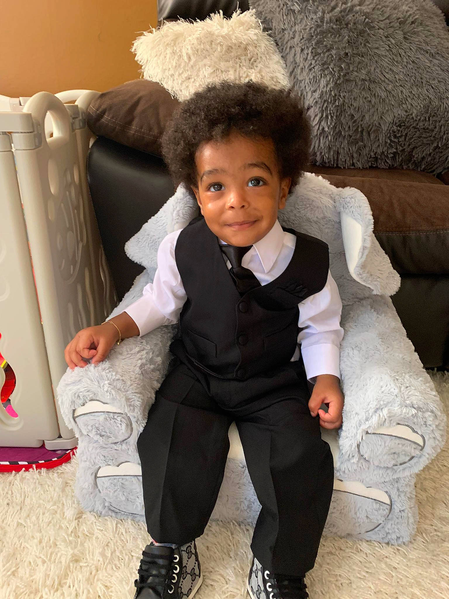 Jayvion joined the competition — help win amazing prizes! baby_toddler_clothing, cheek, child, comfort, eye, flooring, formal_wear, fun, fur, fur_clothing, hairstyle, happy, joy, person, sitting, sleeve, smile, textile, throw_pillow, thumb