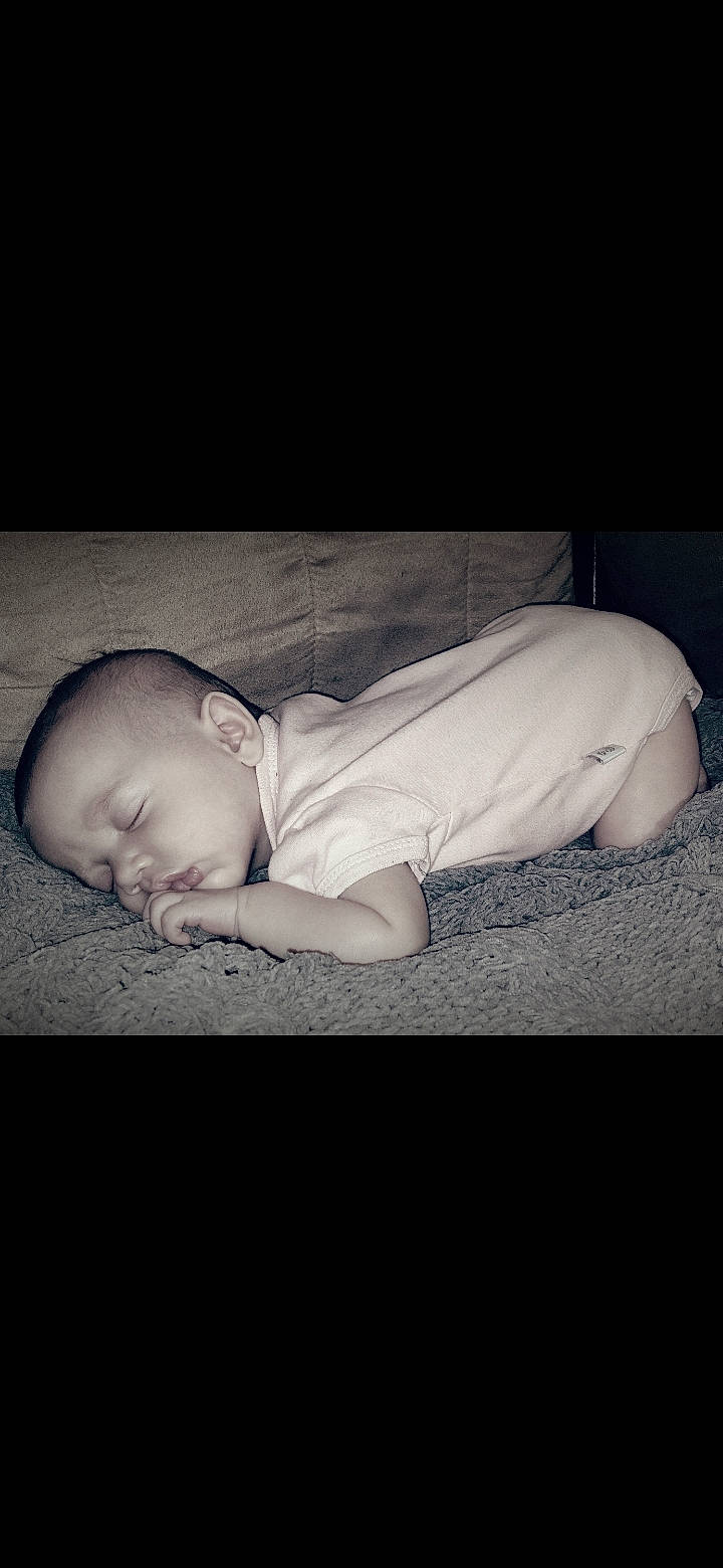 Sennie is registered to the contest to win money with this photo: baby, baby_toddler_clothing, bedtime, child, cloud, comfort, darkness, flash_photography, flooring, font, grass, happy, linens, monochrome, monochrome_photography, nap, person, sitting, sky, tints_and_shades