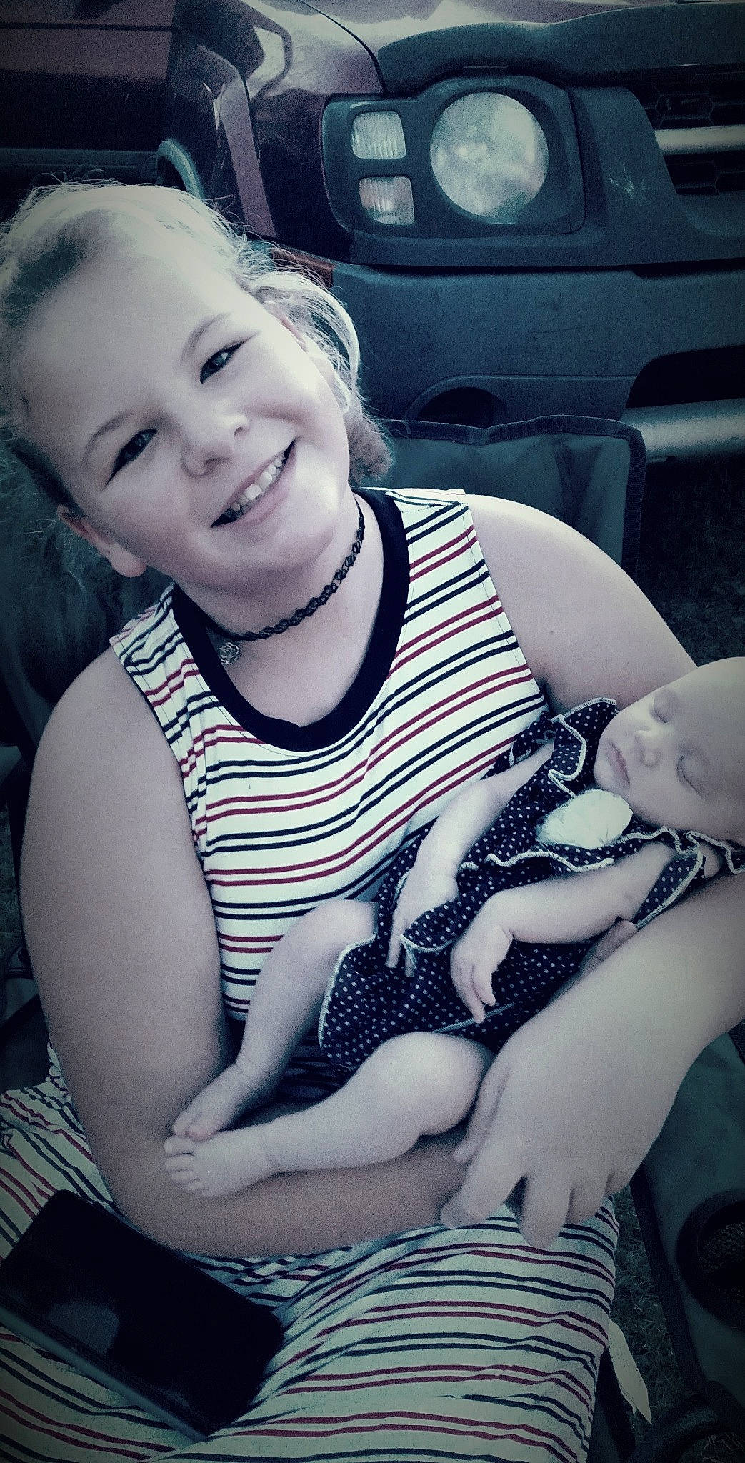 Dixie is registered to the contest to win money with this photo: arm, black, comfort, cool, elbow, eye, eyebrow, finger, flash_photography, hairstyle, happy, joy, knee, lip, mouth, neck, person, skin, smile, style