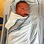 Ezra joined the competition — help win amazing prizes! baby, blanket, face, head, infantbed, person, yawning