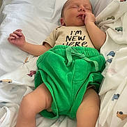 Ezra joined the competition — help win amazing prizes! architecture, baby, bed, bedroom, blanket, building, clothing, cushion, face, furniture, head, homedecor, hospital, indoors, newborn, person, photography, portrait, sleeping, t_shirt