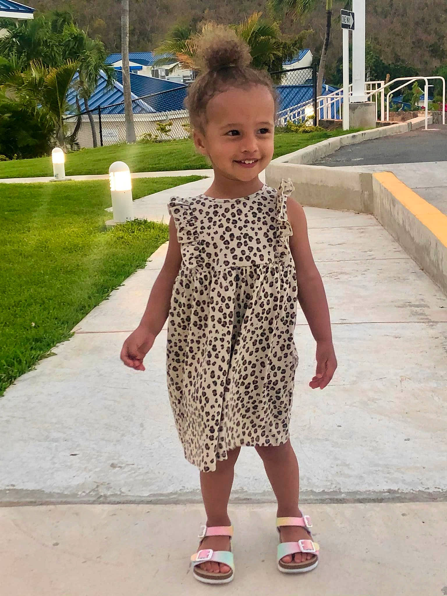 Lyla is registered to the contest to win money with this photo: child, eye, fun, gesture, grass, happy, human_leg, joy, leisure, magenta, pattern, person, plant, recreation, shoulder, sleeve, smile, thigh, toddler, tree