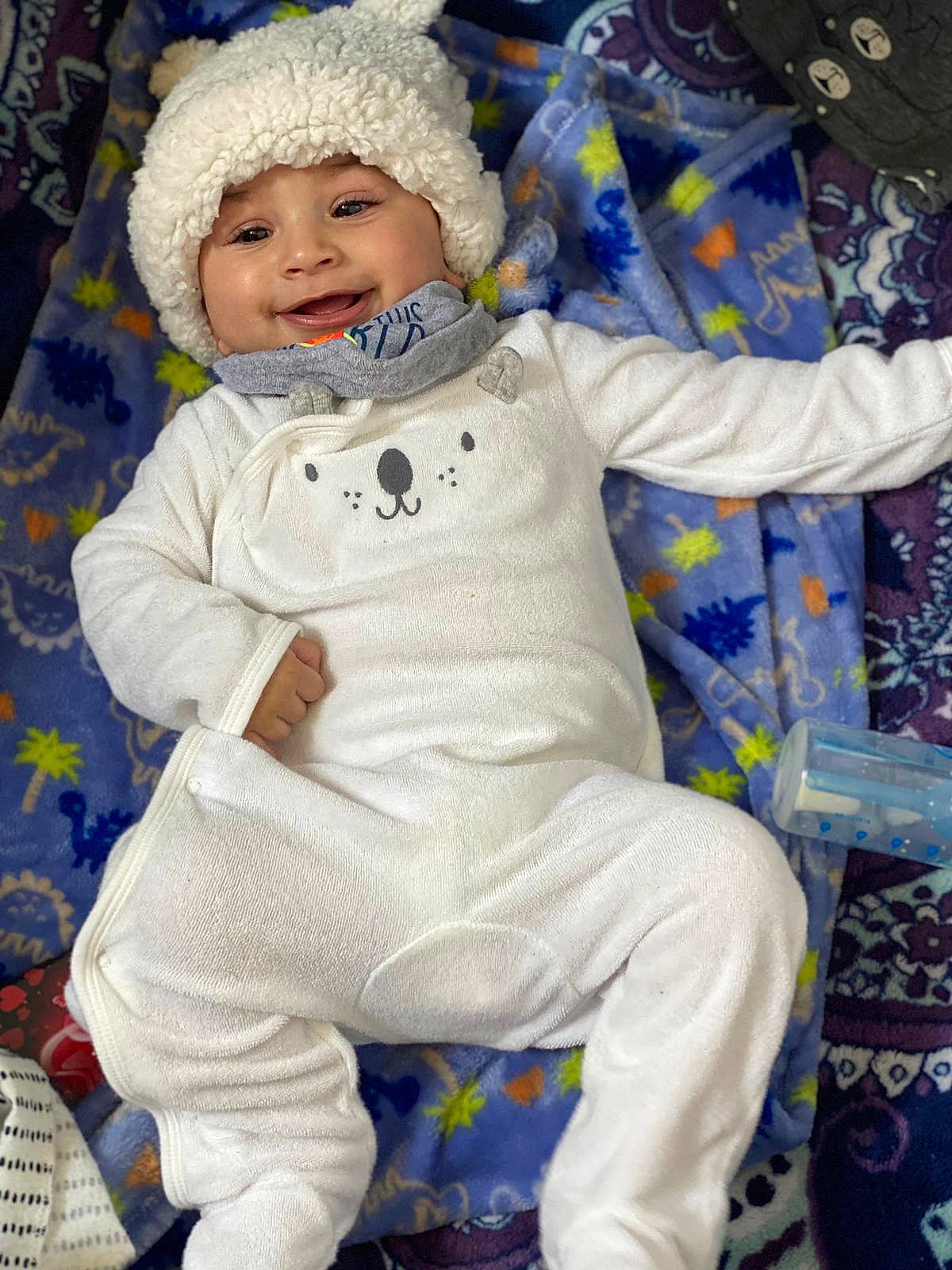 Moises is registered to the contest to win money with this photo: baby, baby_products, baby_toddler_clothing, beanie, bonnet, child, costume, costume_accessory, headwear, joy, knit_cap, nightwear, overall, person, toddler