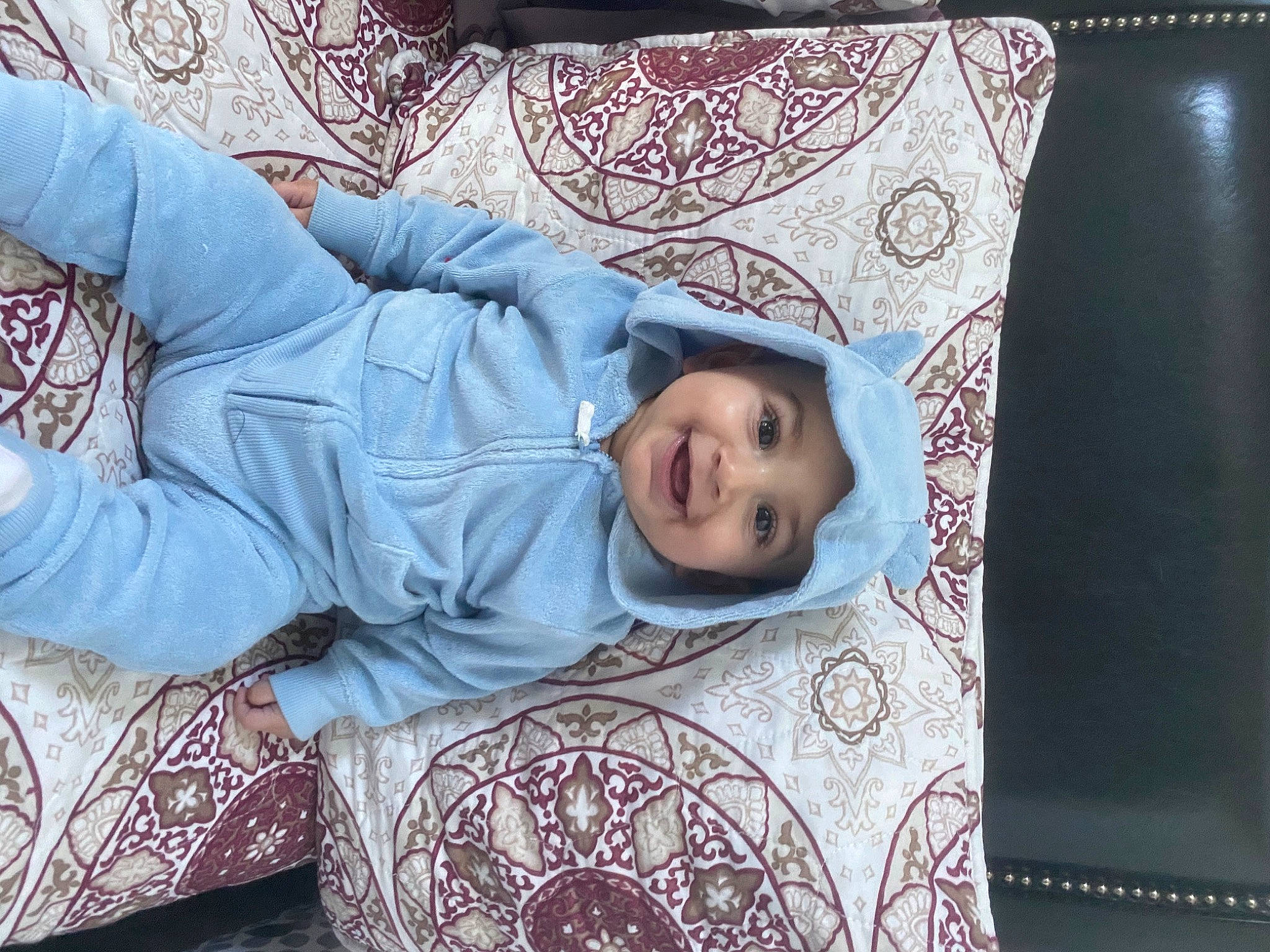 Moises is registered to the contest to win money with this photo: baby, baby_toddler_clothing, bedtime, comfort, couch, eye, headwear, joy, linens, living_room, mouth, nap, nightwear, nose, person, sleep, throw_pillow, toddler