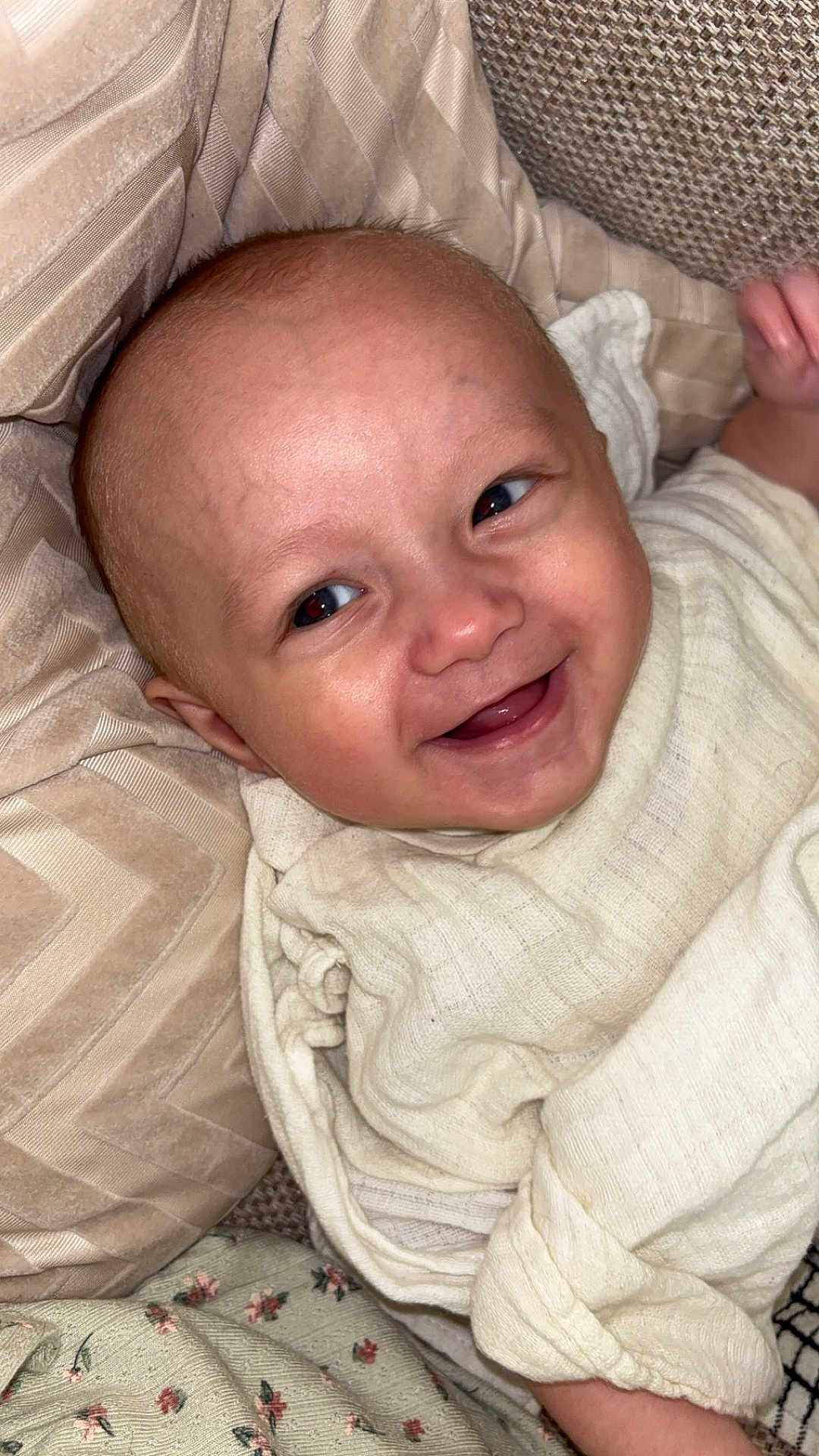 Forrest joined the competition — help win amazing prizes! baby, smile, face, infant, clothing, pillow, blanket, cozy, happy, child, cute, skin, expression, lying_down, comfort, indoors, portrait, closeup, person, soft_fabric