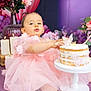 baby, birthday, cake, cake_stand, candles, celebration, child, cute, decor, face, flowers, frosting, hands, indoor, pink_dress, portrait, purple_background, sitting, smile, tulle