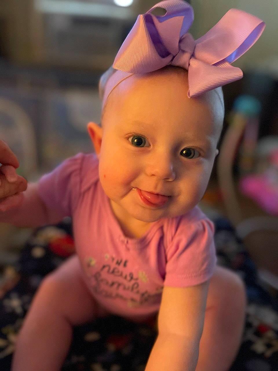 Scarlett joined the competition — help win amazing prizes! baby, birthday, cap, cheek, child, chin, costume_hat, ear, fashion_accessory, fun, happy, headgear, laugh, magenta, party_hat, party_supply, person, pink, sitting, smile
