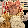 Rynleigh joined the competition — help win amazing prizes! baby, sleeping, blanket, headband, bow, stuffed_animal, crib, pillow, floral, pattern, cute, child, infant, soft_toy, toddler, resting, indoors, cozy, peaceful, colorful