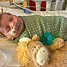 Rynleigh is registered to the contest to win money with this photo: baby, infant, hospital, medical_tubes, blanket, polka_dot, headband, bow, sleeping, plush_toy, lion, pacifier, bed, healthcare, child, cute, resting, patient, nursery, soft_toy