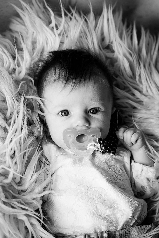 Nora is registered to the contest to win money with this photo: baby, baby_toddler_clothing, cheek, child, eye, eyelash, face, flash_photography, grass, hairstyle, happy, head, human_body, iris, lip, mouth, nose, person, skin, style