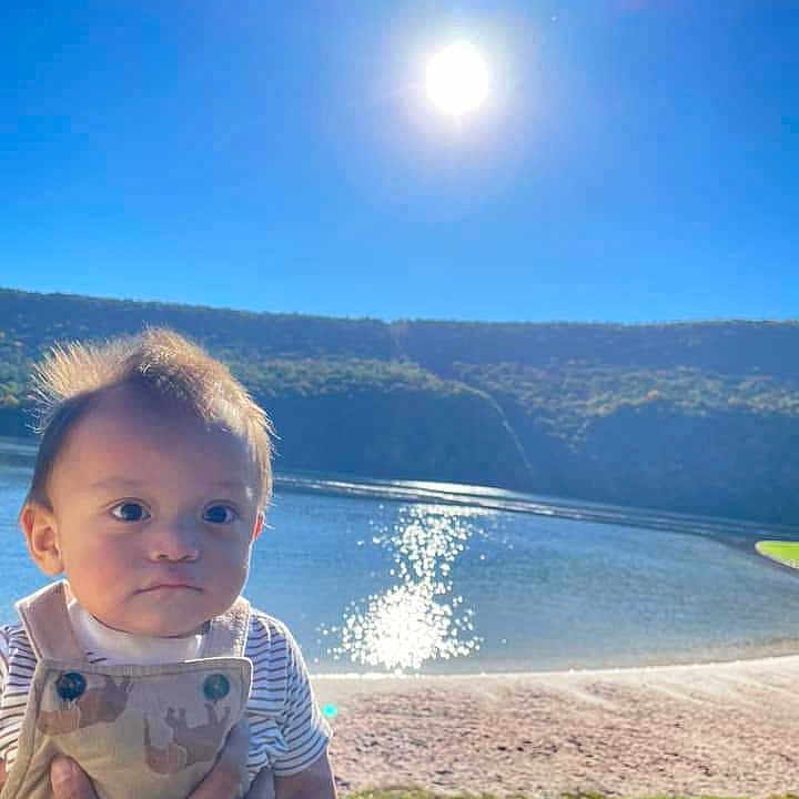 Sebastian is registered to the contest to win money with this photo: astronomy, baby, beach, face, grass, head, lake, moon, nature, night, outdoors, person, photography, plant, portrait, scenery, sea, sky, sun, water