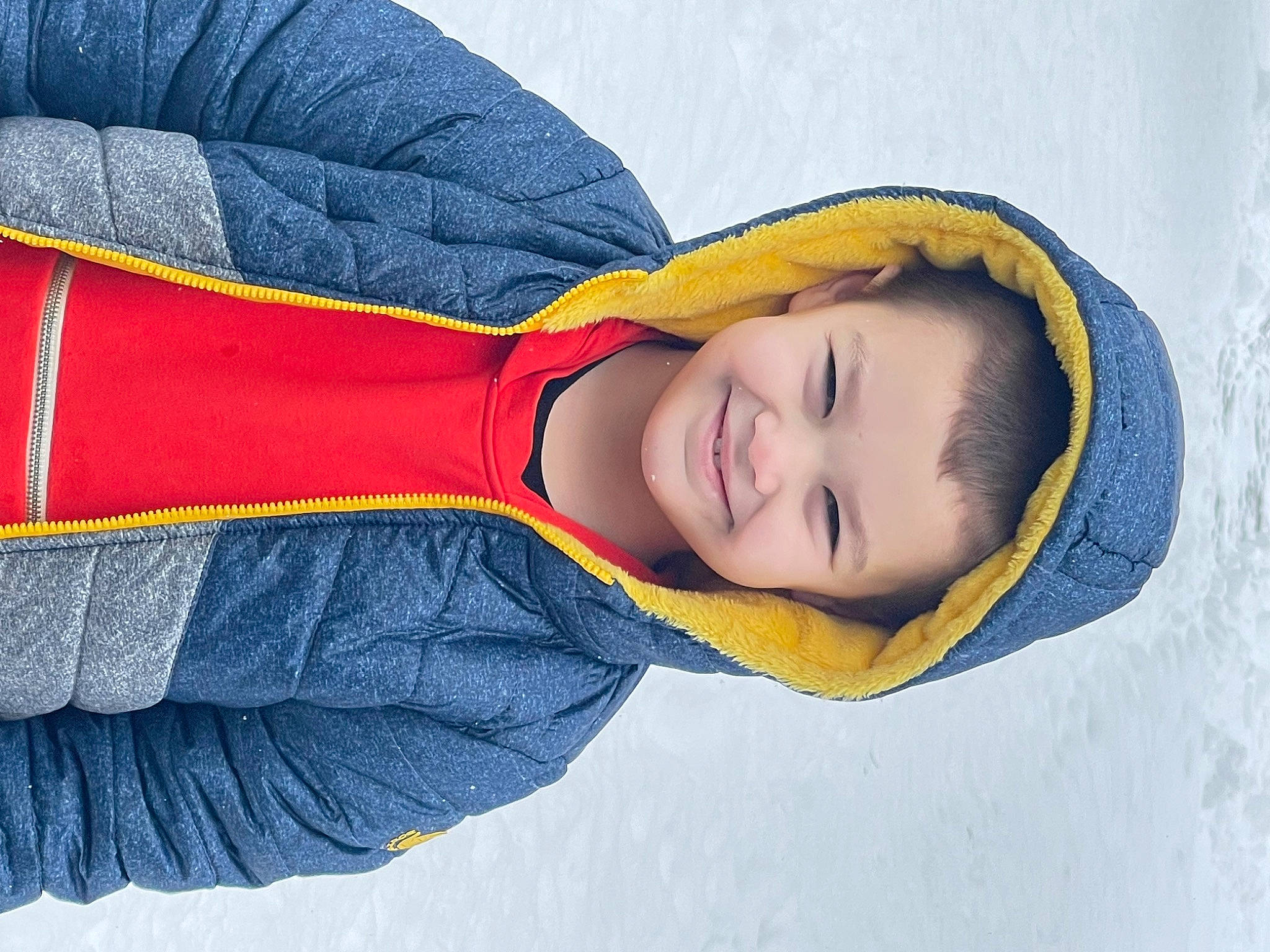 Brysin is registered to the contest to win money with this photo: child, comfort, cool, electric_blue, eye, face, fashion_accessory, fun, happy, headgear, headwear, human_body, joy, leisure, linens, outerwear, person, sleeve, smile, textile