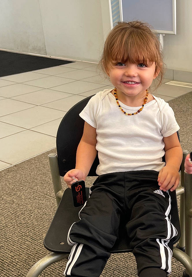 Braden is registered to the contest to win money with this photo: baby_products, baby_toddler_clothing, blond, chair, cheek, child, flooring, fun, hair, human_leg, joint, joy, knee, leg, person, shoulder, sitting, sleeve, smile, sock