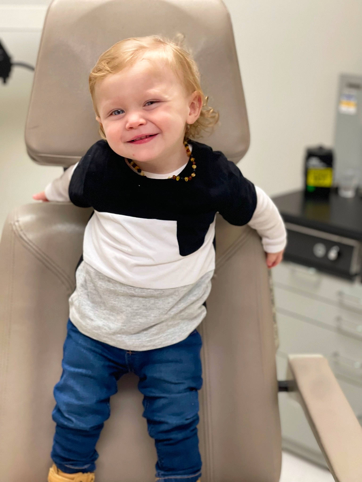 Braxton is registered to the contest to win money with this photo: baby, baby_toddler_clothing, child, comfort, couch, electric_blue, face, finger, flash_photography, hair, happy, head, joint, joy, leg, person, skin, sleeve, smile, standing