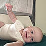 Graesyn joined the competition — help win amazing prizes! arm, baby, bed, blanket, blue_eyes, child, clothing, couch, curtain, face, hand, happy, head, indoor, infant, lying_down, person, reaching, skin, smile