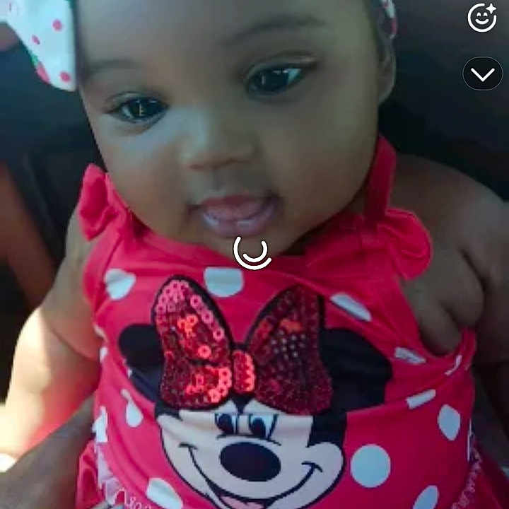 Jurneé is registered to the contest to win money with this photo: baby, child, infant, girl, headband, bow, polka_dot, red_dress, minnie_mouse, cartoon_character, smiling, happy, person, portrait, closeup, clothing, cute, indoor, hand, app_interface