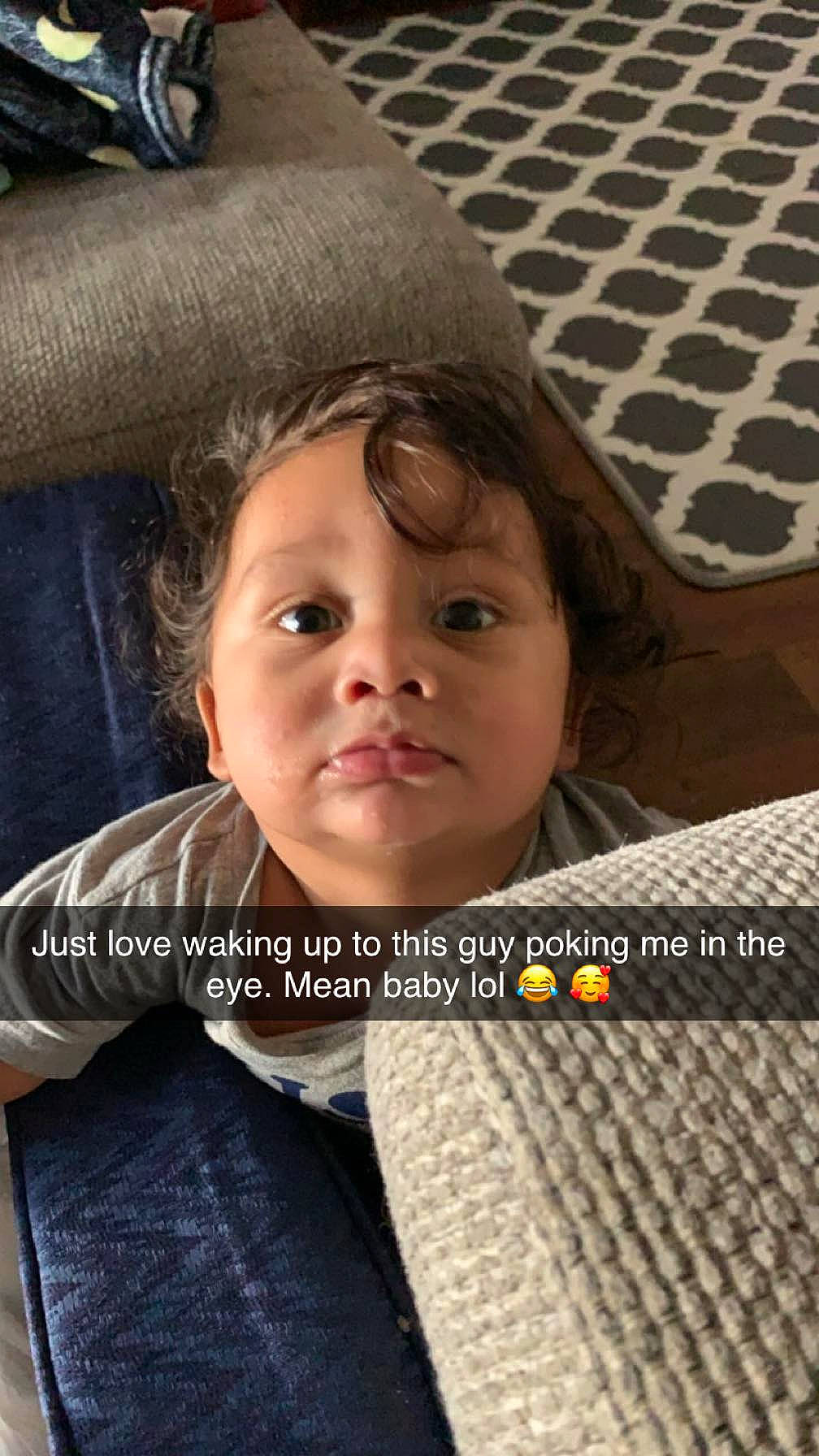 Dakota is registered to the contest to win money with this photo: cap, cheek, child, comfort, eye, flash_photography, flooring, font, fur, happy, linens, nose, pattern, person, photo_caption, portrait_photography, room, sitting, smile, toddler