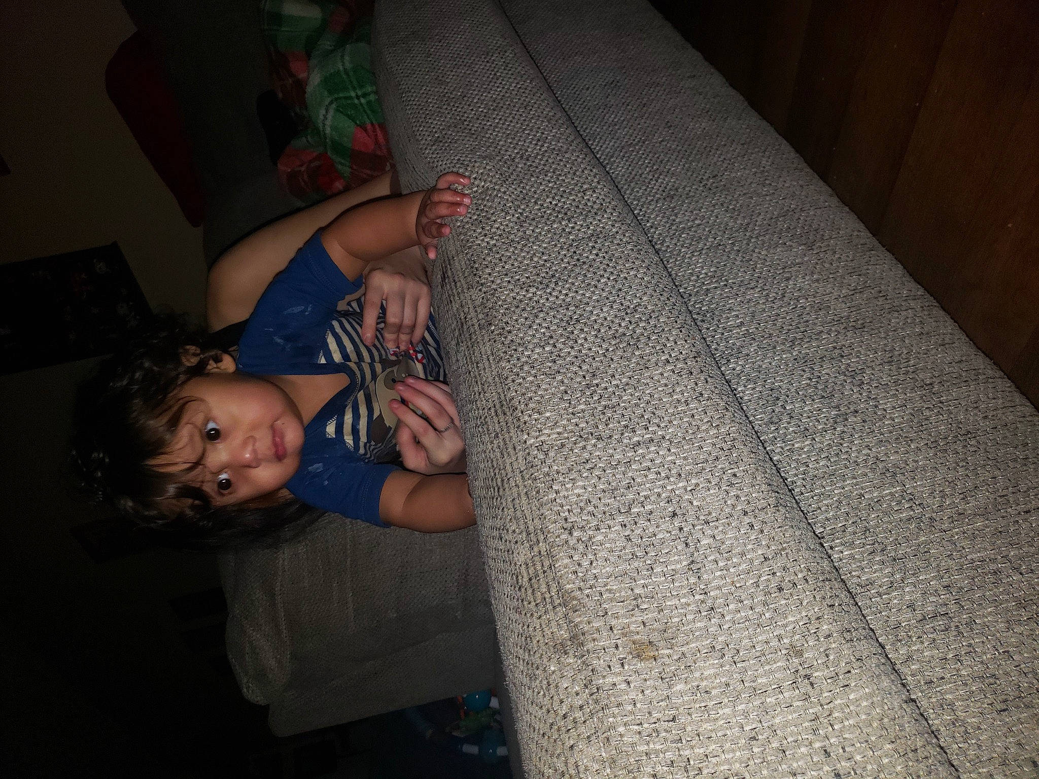 Dakota is registered to the contest to win money with this photo: child, comfort, darkness, elbow, flash_photography, floor, flooring, fun, hardwood, human_body, human_leg, pattern, person, room, sitting, smile, textile, thigh, toddler, trunk