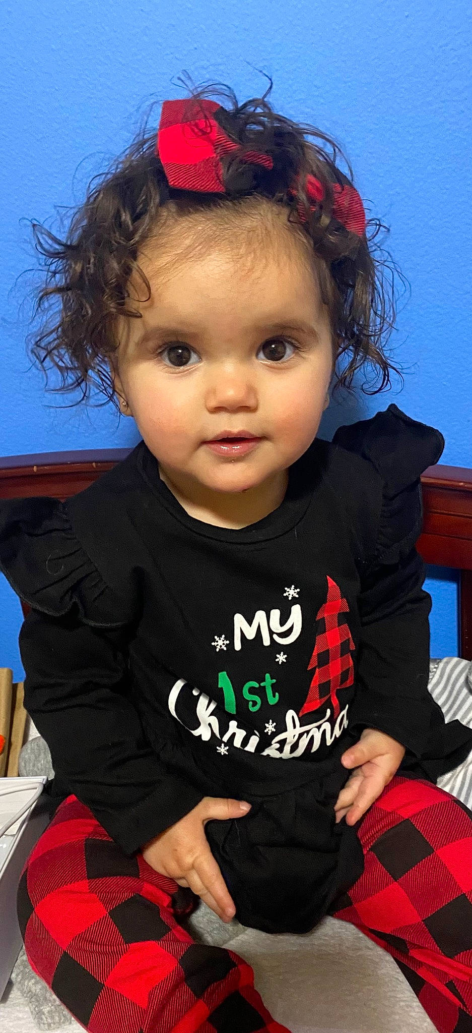 Kaycee is registered to the contest to win money with this photo: black, cheek, chin, eyebrow, facial_expression, forehead, hairstyle, happy, head, human, iris, lip, neck, nose, organ, person, skin, sleeve, standing, tartan