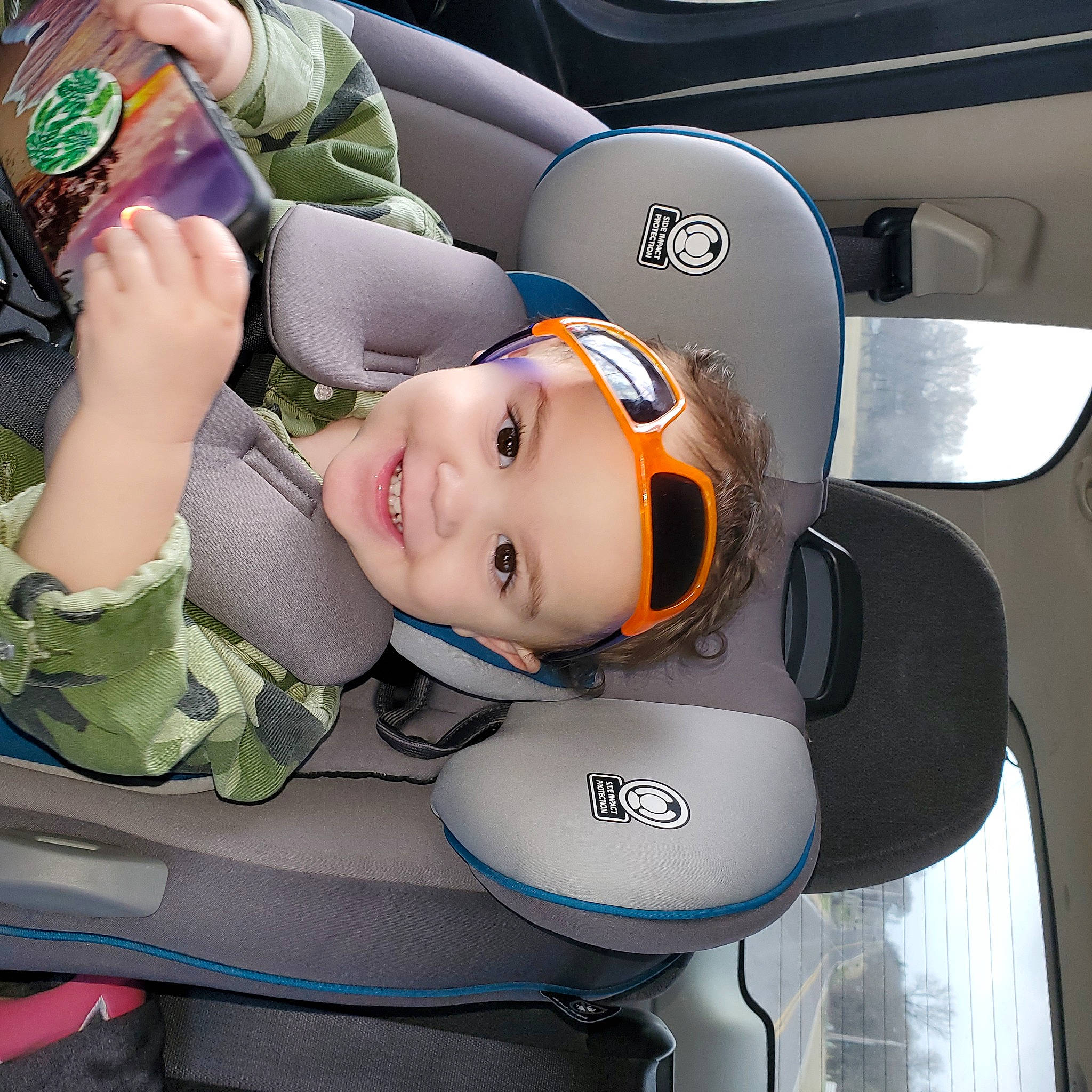 Kooper joined the competition — help win amazing prizes! audio_equipment, auto_part, automotive_design, automotive_exterior, automotive_lighting, automotive_wheel_system, car, car_seat, family_car, hat, headgear, headwear, helmet, joy, motor_vehicle, person, personal_protective_equipment, smile, sports_gear, toddler