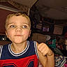 Michael is registered to the contest to win money with this photo: child, boy, portrait, face, smiling, serious_expression, blue_eyes, blond_hair, jersey, sportswear, number_04, indoor, home, bedroom, cluttered_room, furniture, blanket, close_up, flash_photography, raised_arm