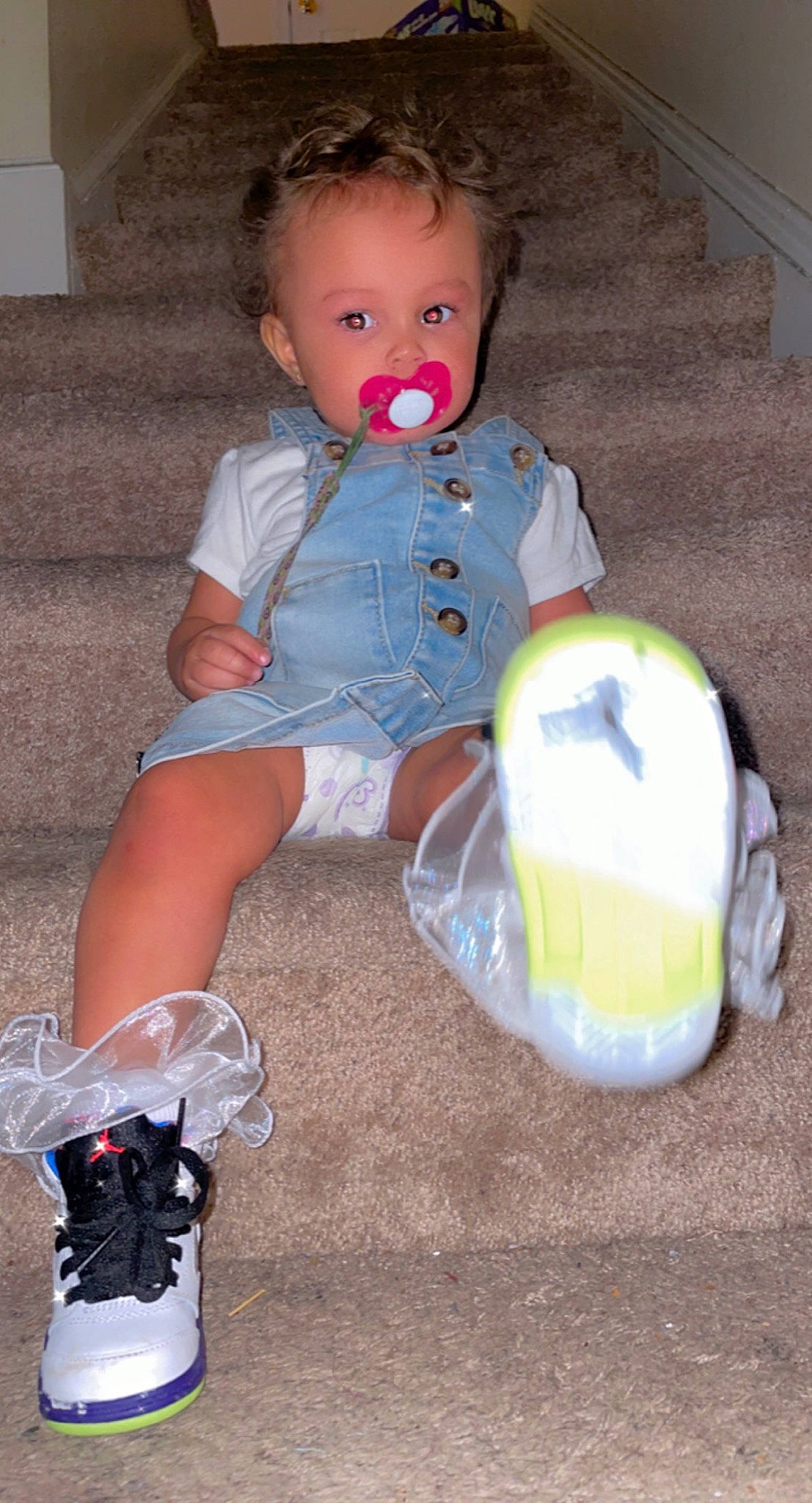 Keilani is registered to the contest to win money with this photo: baby, baby_toddler_clothing, carmine, cheek, child, electric_blue, foot, fun, human_leg, iris, knee, mammal, pattern, person, pink, plastic, sitting, sleeve, sock, thigh