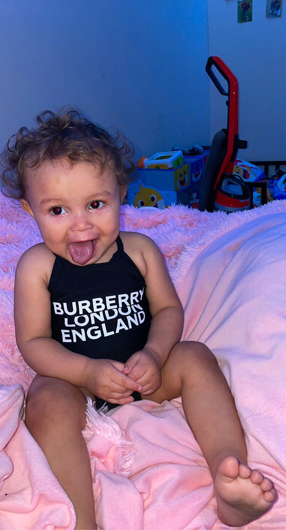 Keilani is registered to the contest to win money with this photo: baby_toddler_clothing, dress, eye, facial_expression, flash_photography, hair, hairstyle, happy, head, human_body, leg, mouth, muscle, organ, person, product, purple, skin, smile, textile