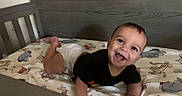 Koa joined the competition — help win amazing prizes! baby, crib, diaper, smiling, happy, infant, winnie_the_pooh, blanket, cartoon_characters, wooden_crib, cute, child, toddler, playful, indoors, portrait, crawling, clothing, person, bedroom