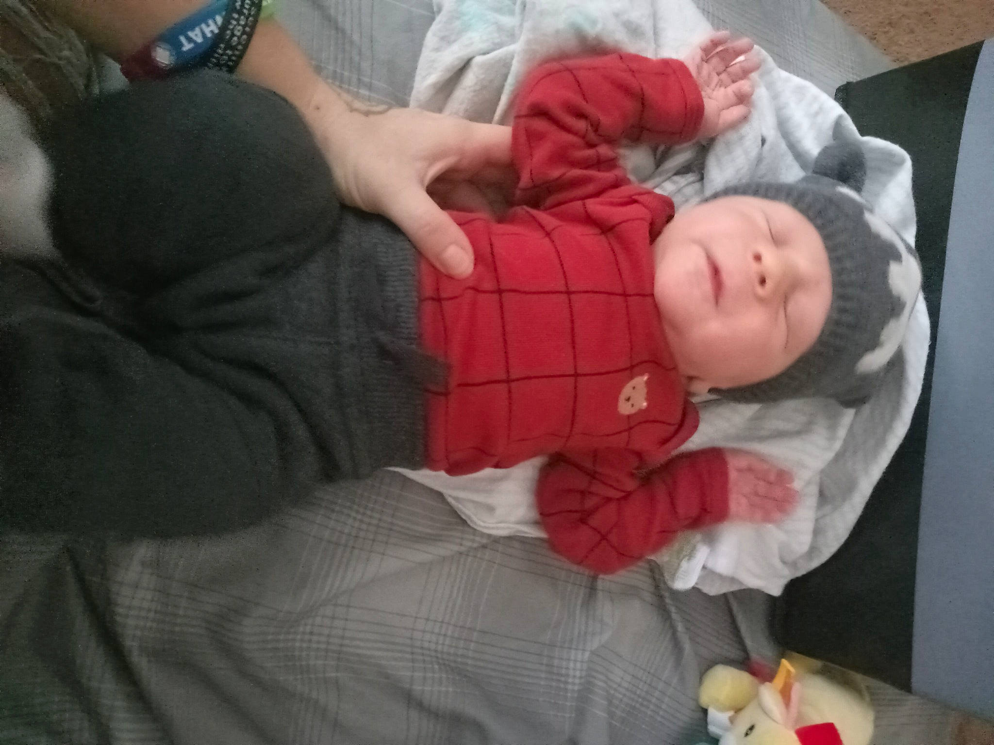 Jackson is registered to the contest to win money with this photo: arm, baby, baby_products, baby_toddler_clothing, child, comfort, elbow, finger, gesture, hand, headwear, lap, linens, nap, person, room, sitting, sleep, sleeve, toddler