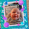 Freyja is registered to the contest to win money with this photo: baby, celebration, clothing, colorful, crafting, cute, decoration, face, fathers_day, frame, glitter, happy, indoors, infant, portrait, smiling, sparkles, stickers, table, wood