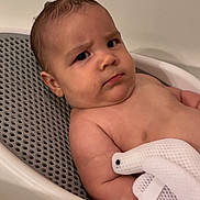 Waylon is registered to the contest to win money with this photo: architecture, baby, bathing, bathtub, bodypart, building, face, finger, hand, happy, head, hospital, newborn, person, photography, portrait, smile, towel, tub