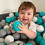 baby, ball, balloon, bodypart, face, finger, football, hand, happy, head, person, photography, portrait, sitting, smile, soccer, soccerball, sphere, sport, turquoise