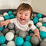 Luca is registered to the contest to win money with this photo: baby, babylaughing, ball, balloon, face, football, happy, head, indoors, laughing, people, person, photography, portrait, sitting, smile, soccer, soccerball, sphere, sport