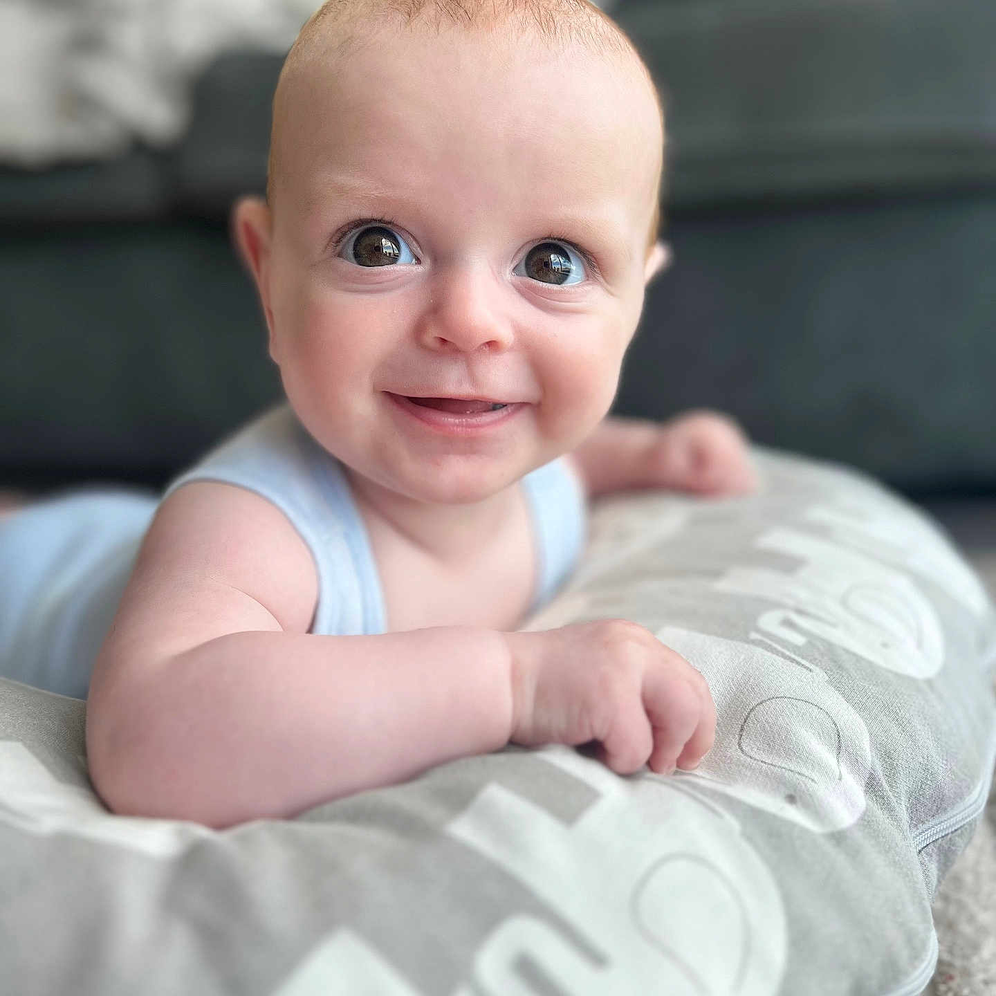 Hunter is registered to the contest to win money with this photo: baby, babylaughing, bed, bedroom, blanket, bodypart, cushion, face, finger, furniture, hand, happy, head, homedecor, laughing, newborn, person, photography, portrait, smile