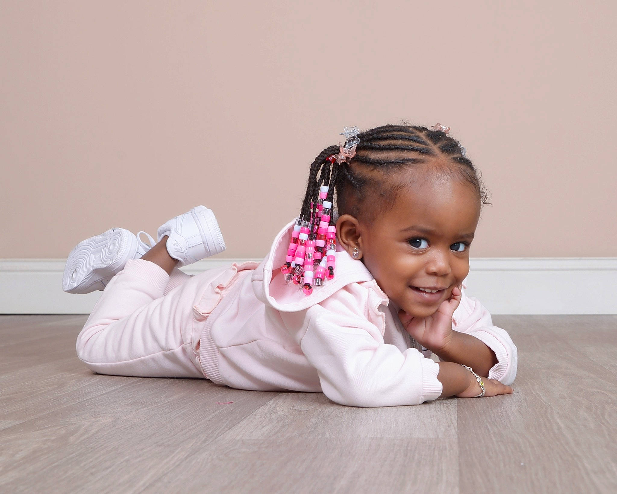 Amirah is registered to the contest to win money with this photo: audio_equipment, baby, baby_toddler_clothing, comfort, eyelash, fashion_accessory, flooring, fun, hair_accessory, happy, hardwood, headband, headpiece, human_leg, jewellery, joy, person, sitting, sleeve, smile