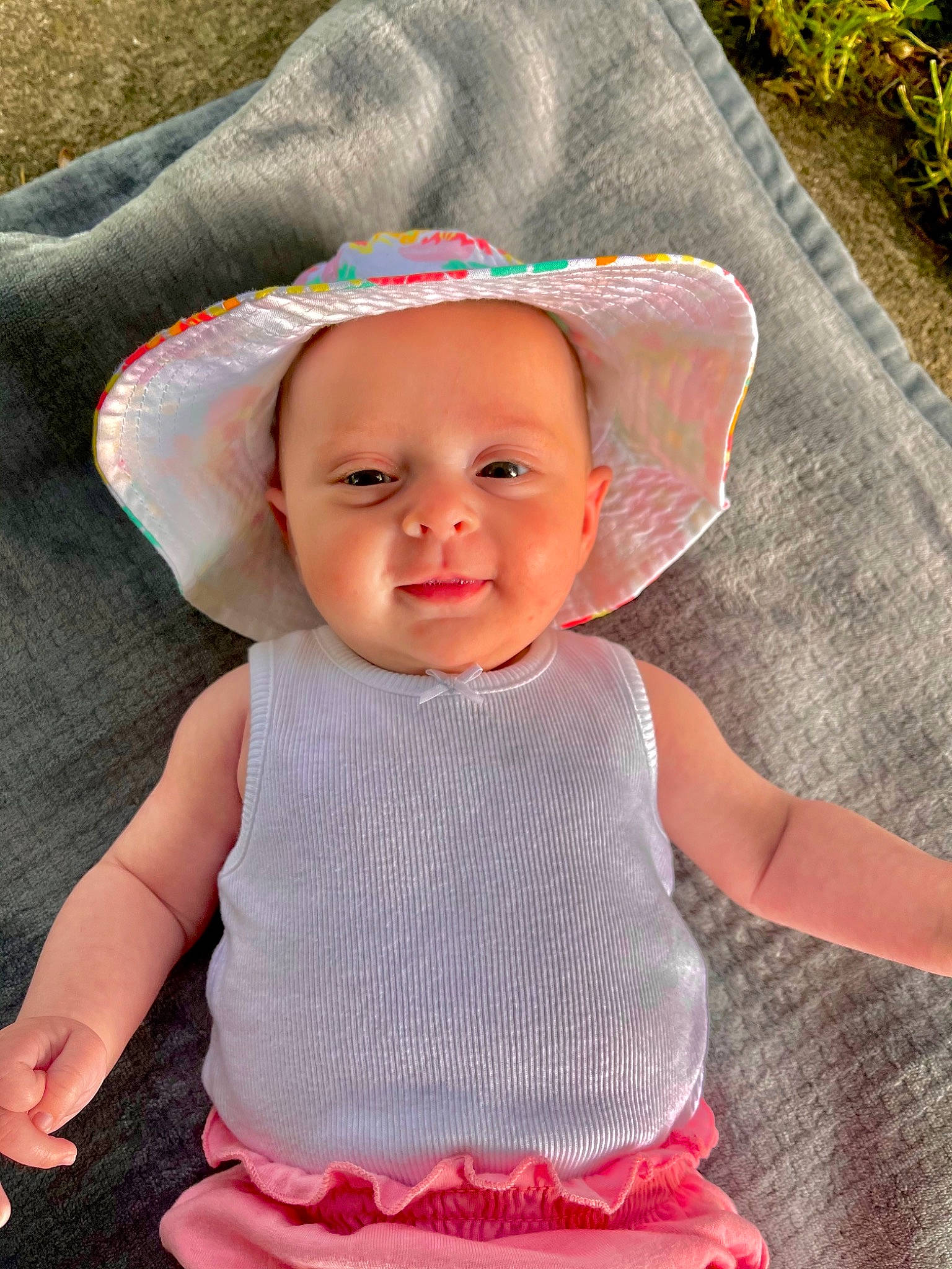 Briana joined the competition — help win amazing prizes! baby, baby_toddler_clothing, cheek, chin, eye, face, grass, green, happy, hat, lip, person, photograph, pink, product, skin, sleeve, smile, sun_hat, textile