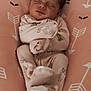 Addilynn joined the competition — help win amazing prizes! newborn, baby, sleeping, infant, pink, onesie, animal_print, cushion, arrow_pattern, cozy, peaceful, face, footed_pajamas, child, resting, soft_fabric, indoors, cute, portrait, relaxing