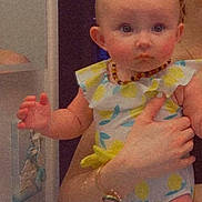 Bellamy joined the competition — help win amazing prizes! baby, child, person, indoor, clothing, onesie, necklace, hand, adult, holding, face, skin, curious, expression, colorful, furniture, watch, ear, arm, portrait