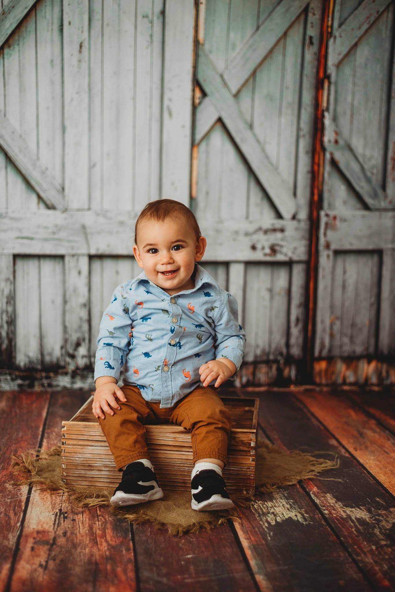 Hudson is registered to the contest to win money with this photo: baby_toddler_clothing, child, door, face, flash_photography, floor, flooring, grass, happy, hardwood, joy, leaf, line, people_in_nature, person, sitting, smile, sneakers, tints_and_shades, toddler
